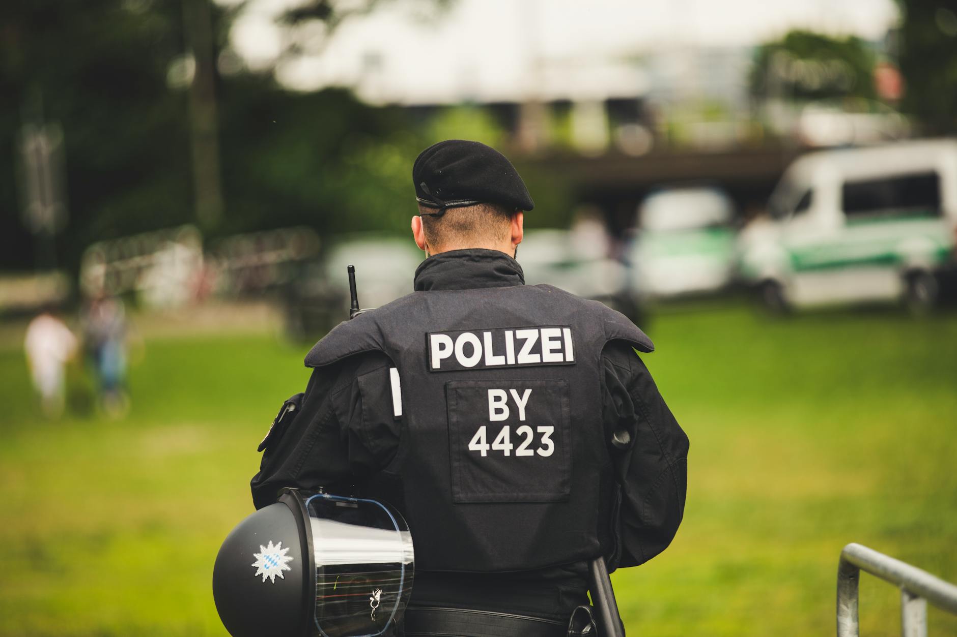 A police officer stands in uniform outdoors, highlighting law enforcement — TransferCredit.org
