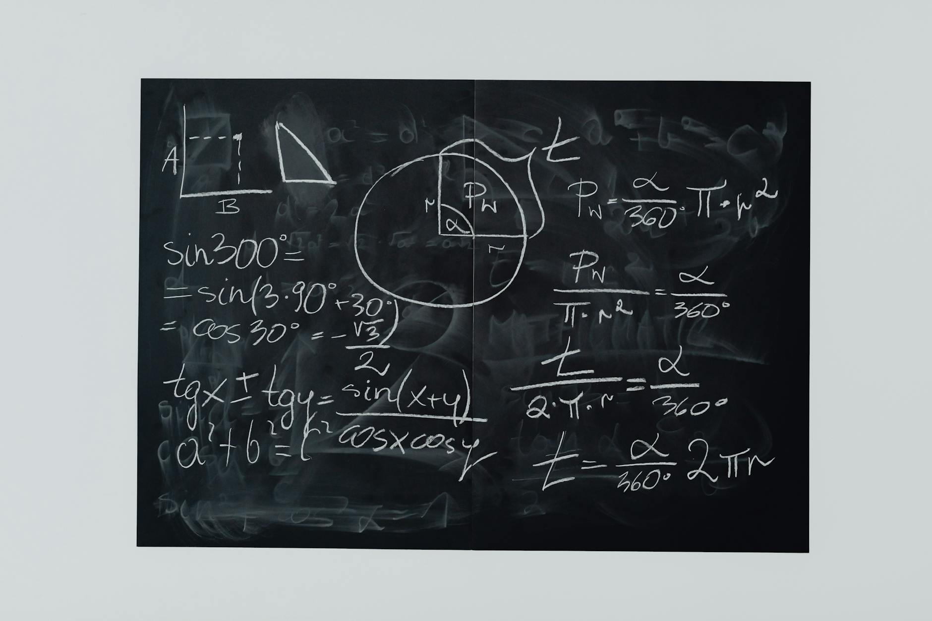 Detailed view of mathematical equations and diagrams on a blackboard — TransferCredit.org