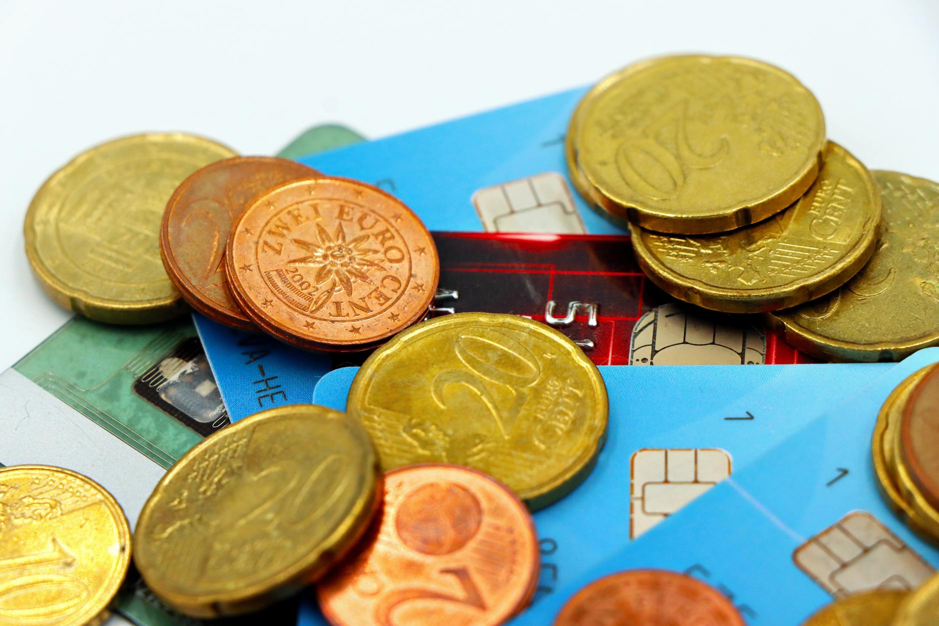 Close-up image of Euro coins and credit cards representing modern financial transactions — TransferCredit.org