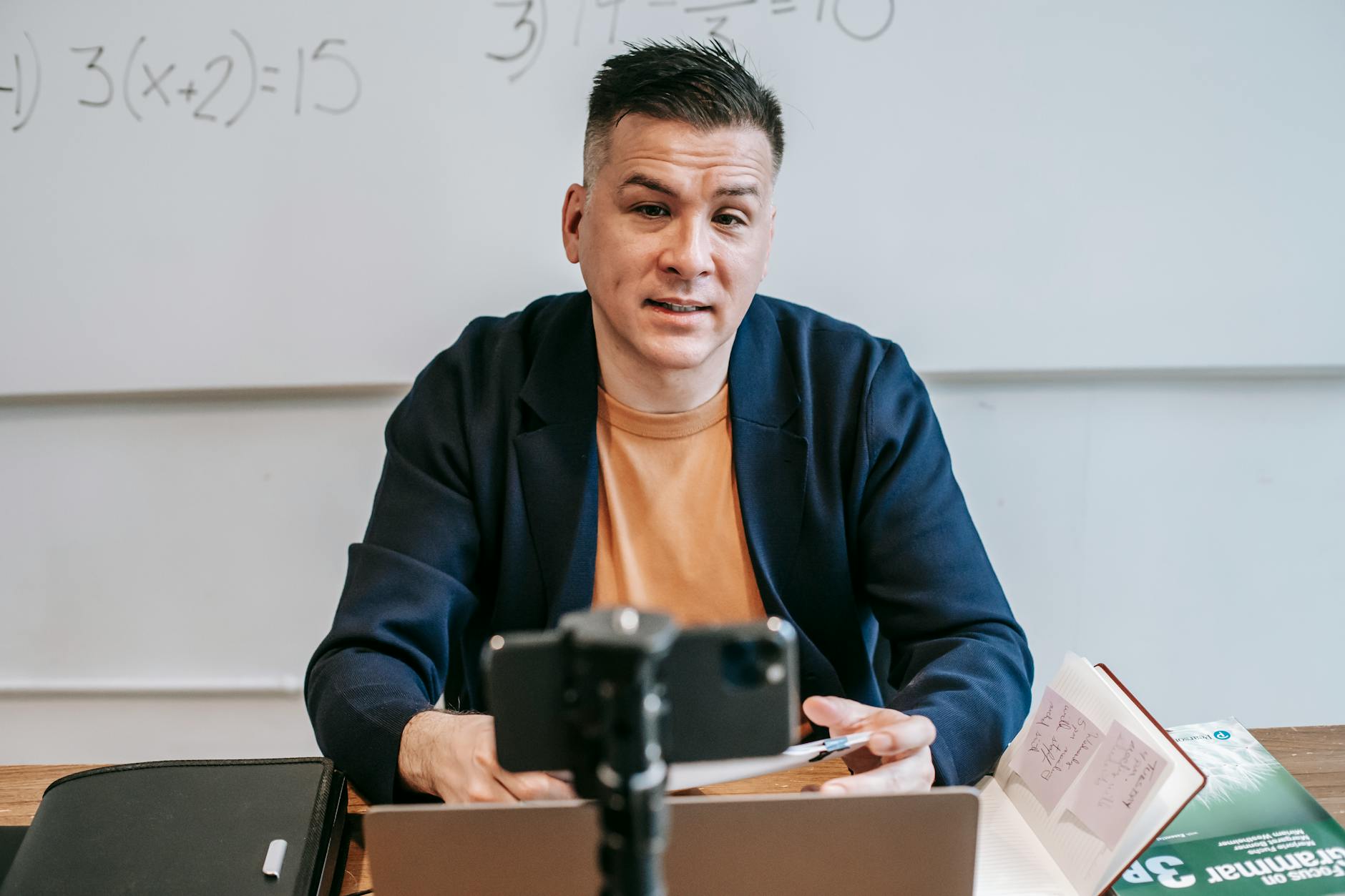 A professional educator conducting an online class, engaging with students via video call — TransferCredit.org